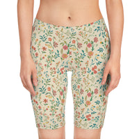 Front view of the Petal Flower Bike Shorts with Blossom Cream Design, worn by one model, highlighting the floral print and soft cream base.
