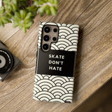 Samsung Galaxy S24 Ultra Minimalist Tough Case with Skate Don't Hate Quotes on wooden table.