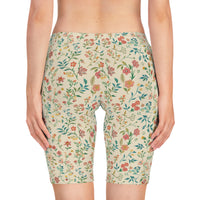 Back view of the Blossom Cream bike shorts on a model, showcasing the petal-inspired print wrapping around the back.