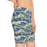 Side shot of the Great Wave shorts worn by a female model, showing dynamic art and body-hugging silhouette.
